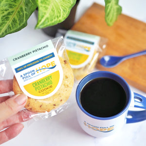 A Spoon Full of Hope Cranberry Pistachio Shortbread cookie with Coffee Mug and ceramic spoon